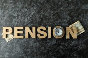 Concept of pension or retirement plan on black smokey table